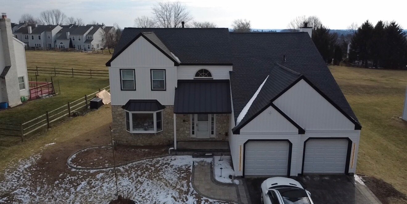 New siding & standing-seam metal roof — after